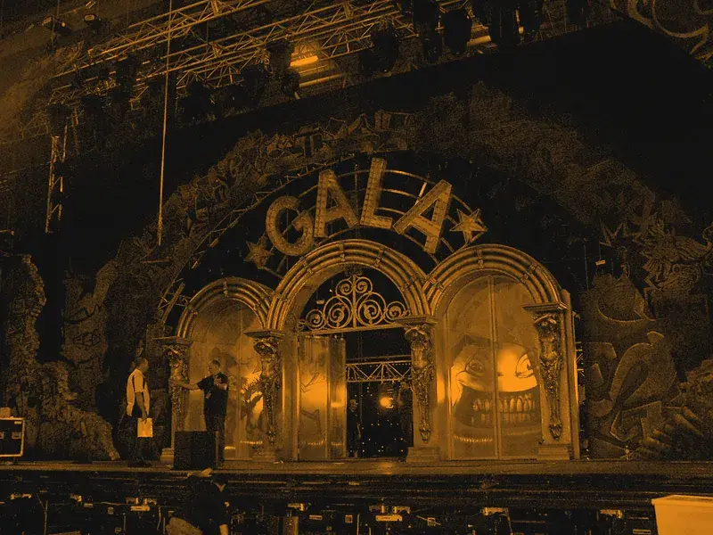 Printed scenic archway backdrop on a theatre stage