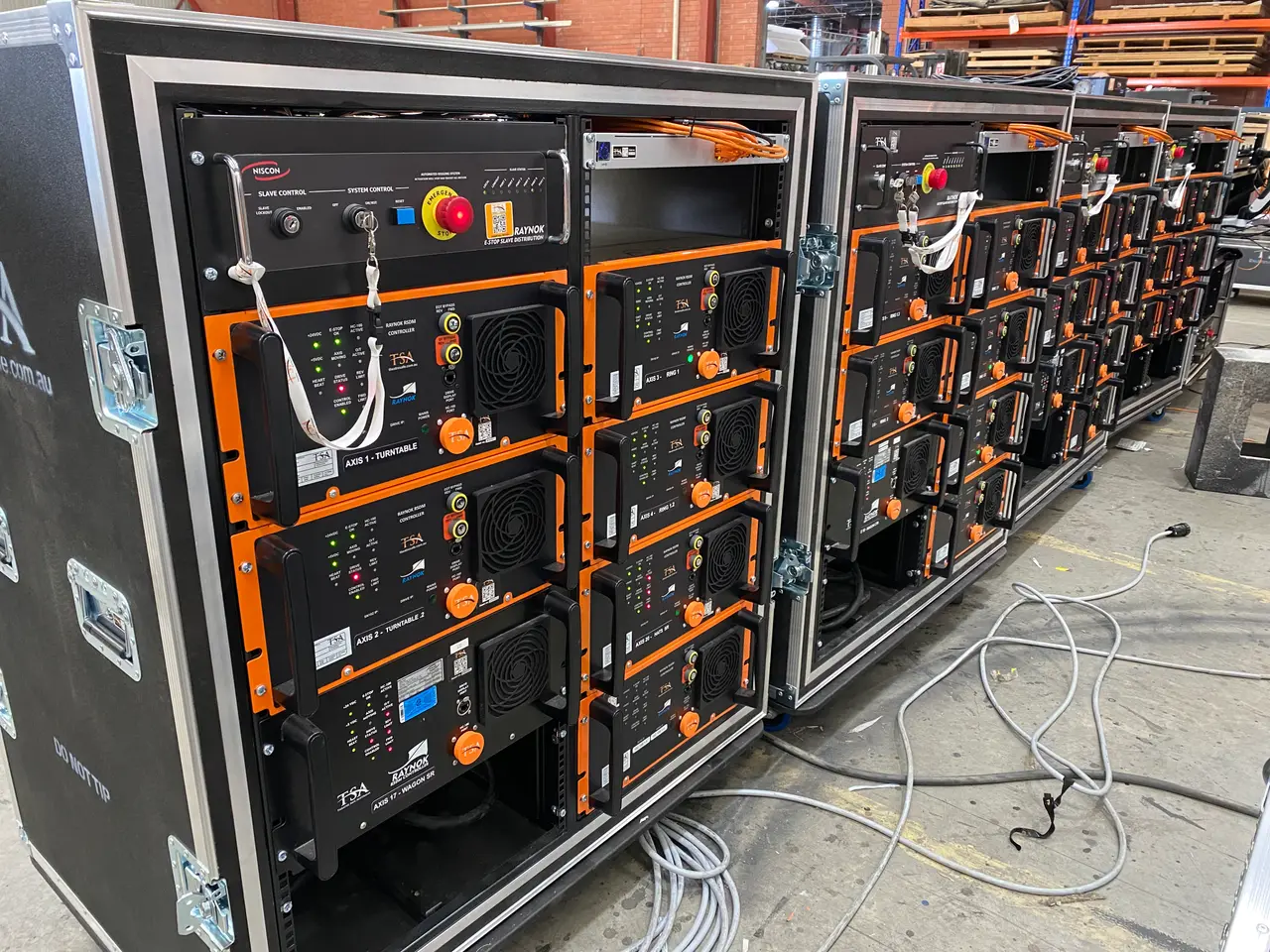 Raynok automation control racks with turntable axis modules staged in the warehouse
