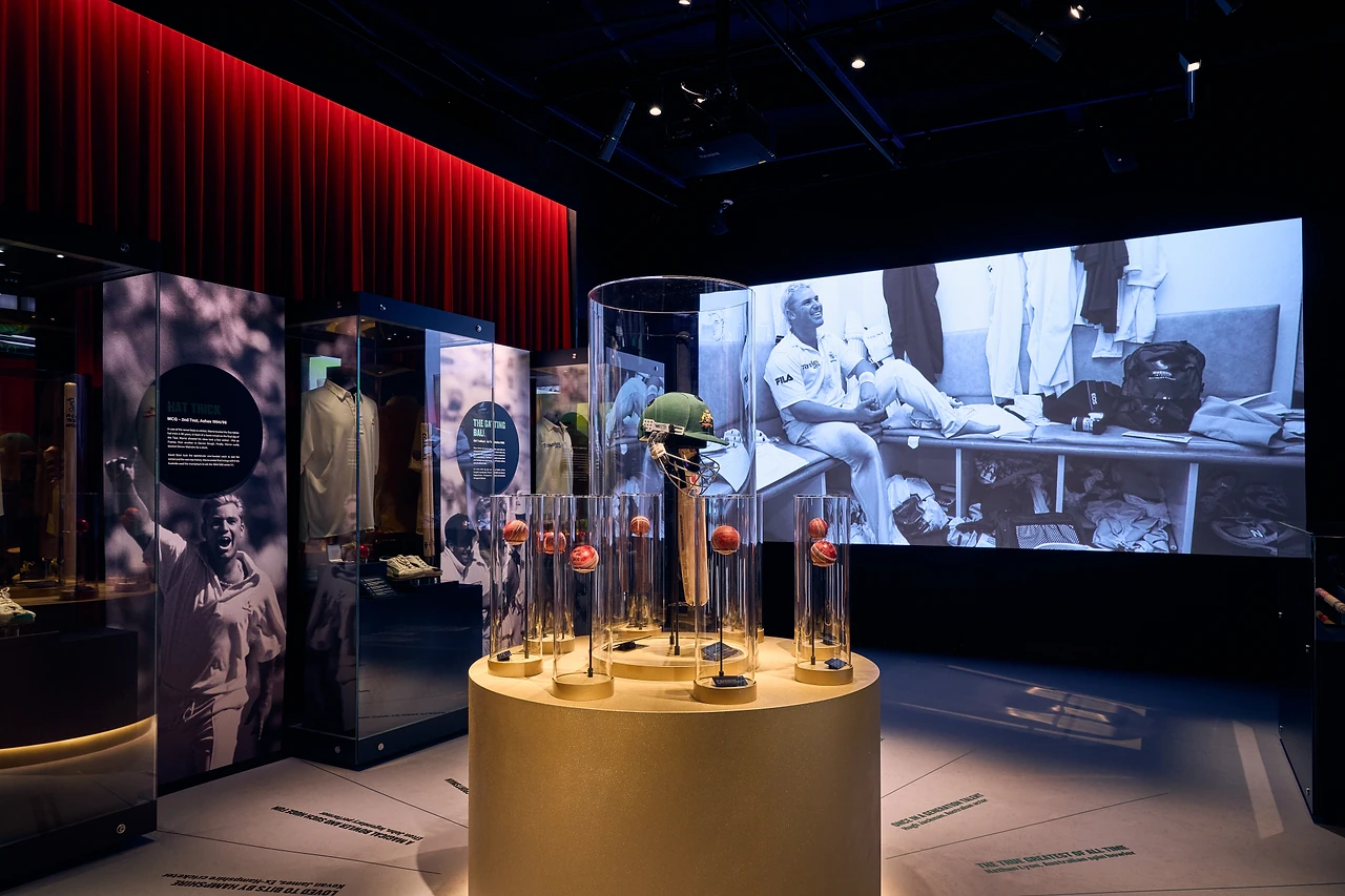 Gallery view of the plinth, showcases and a large archive video screen