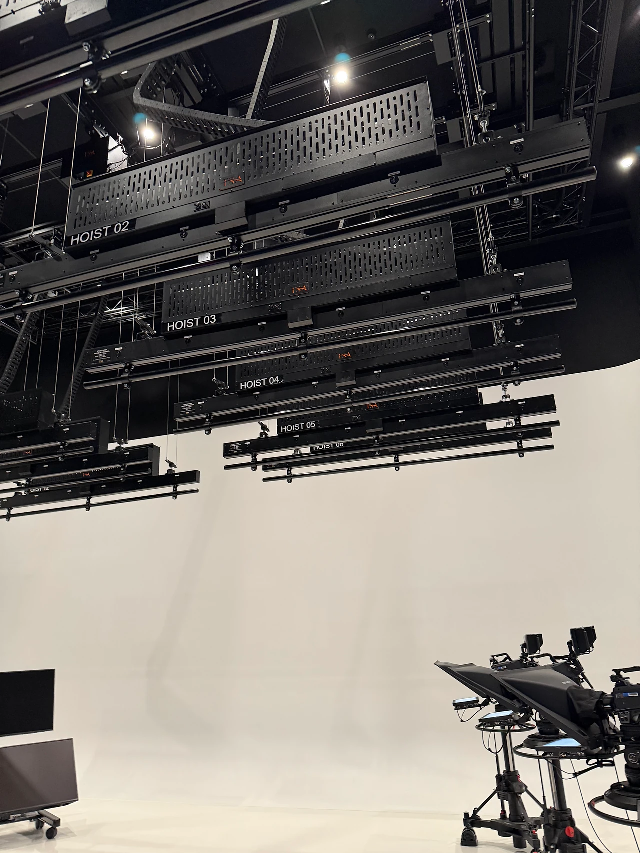 Lighting battens and the cyclorama wall in a production studio at ECU City Campus.
