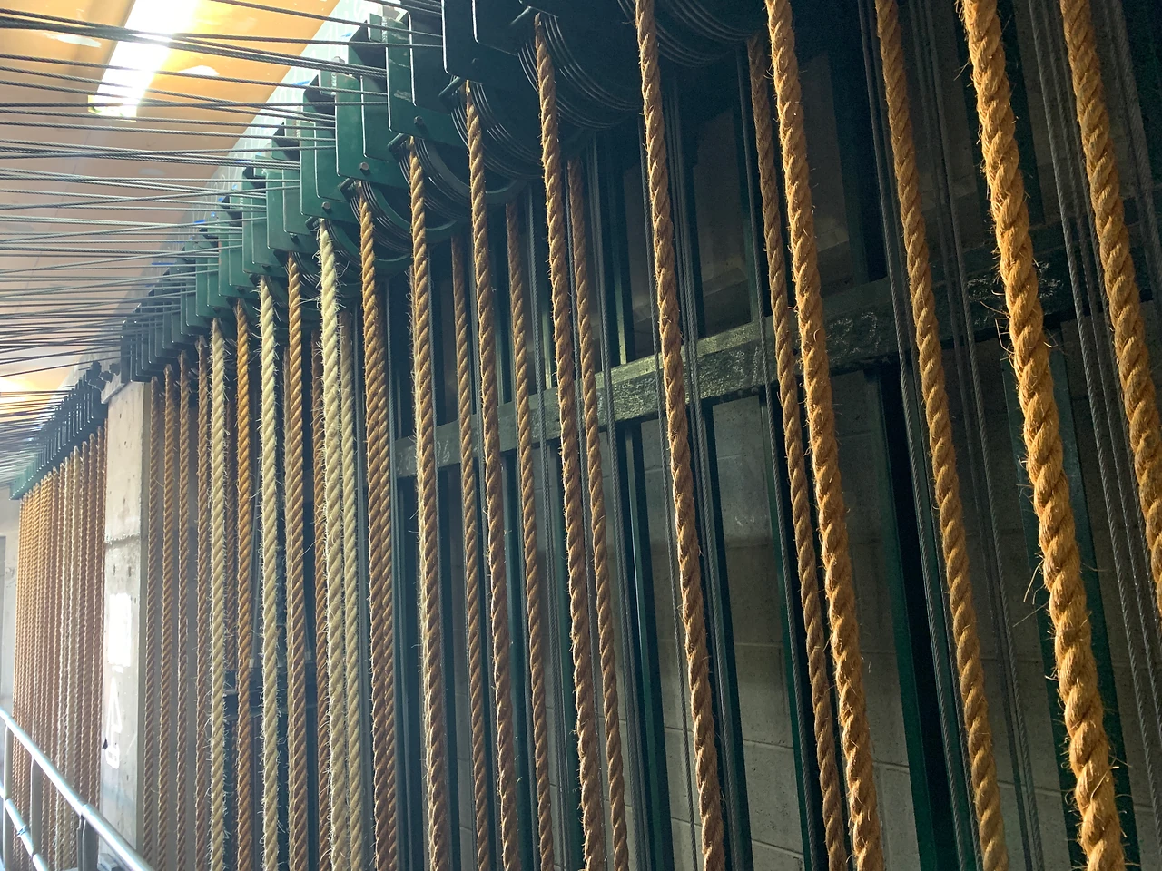 Hemp lines running down past the green arbours of the counterweight fly system at Gladstone Entertainment & Convention Centre.