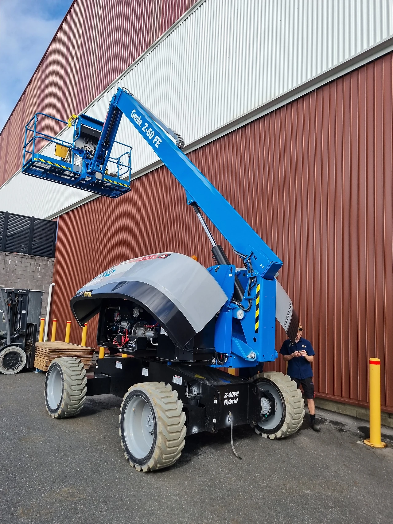Boom lift parked outside the arena ready for in-situ hoist servicing