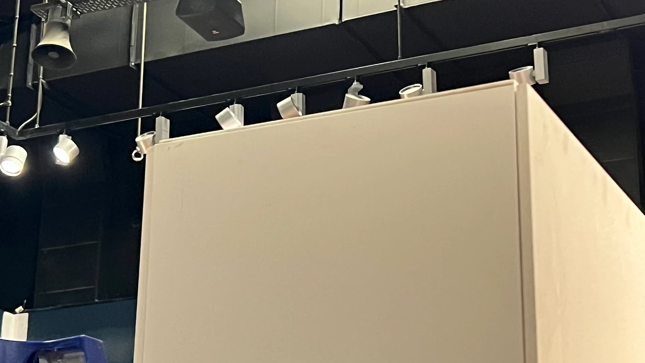 Top edge of the modular wall rising into the gallery track lighting. Design: Tim Blaikie, TSA. Photo: TSA.