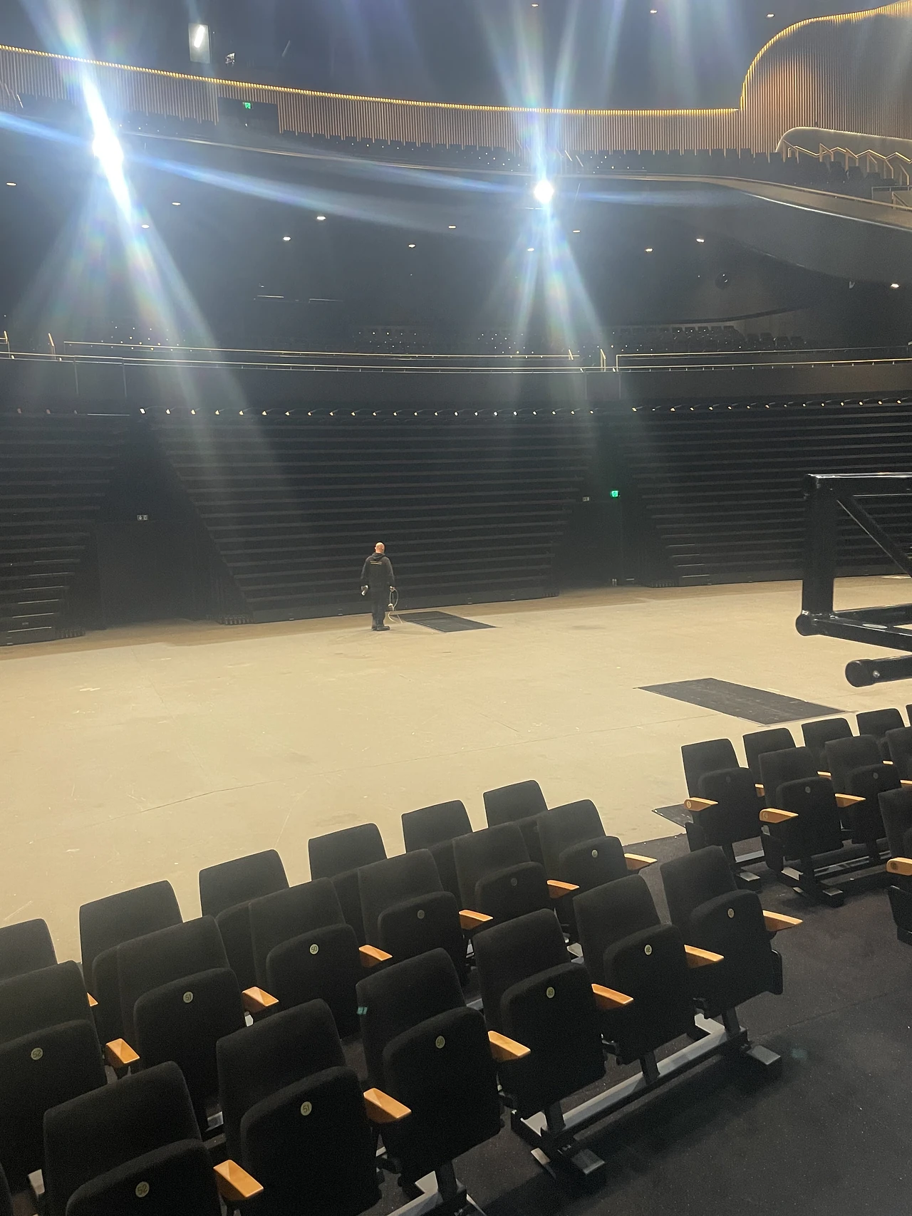 Retractable seating bank at stage level with the auditorium and circle behind it
