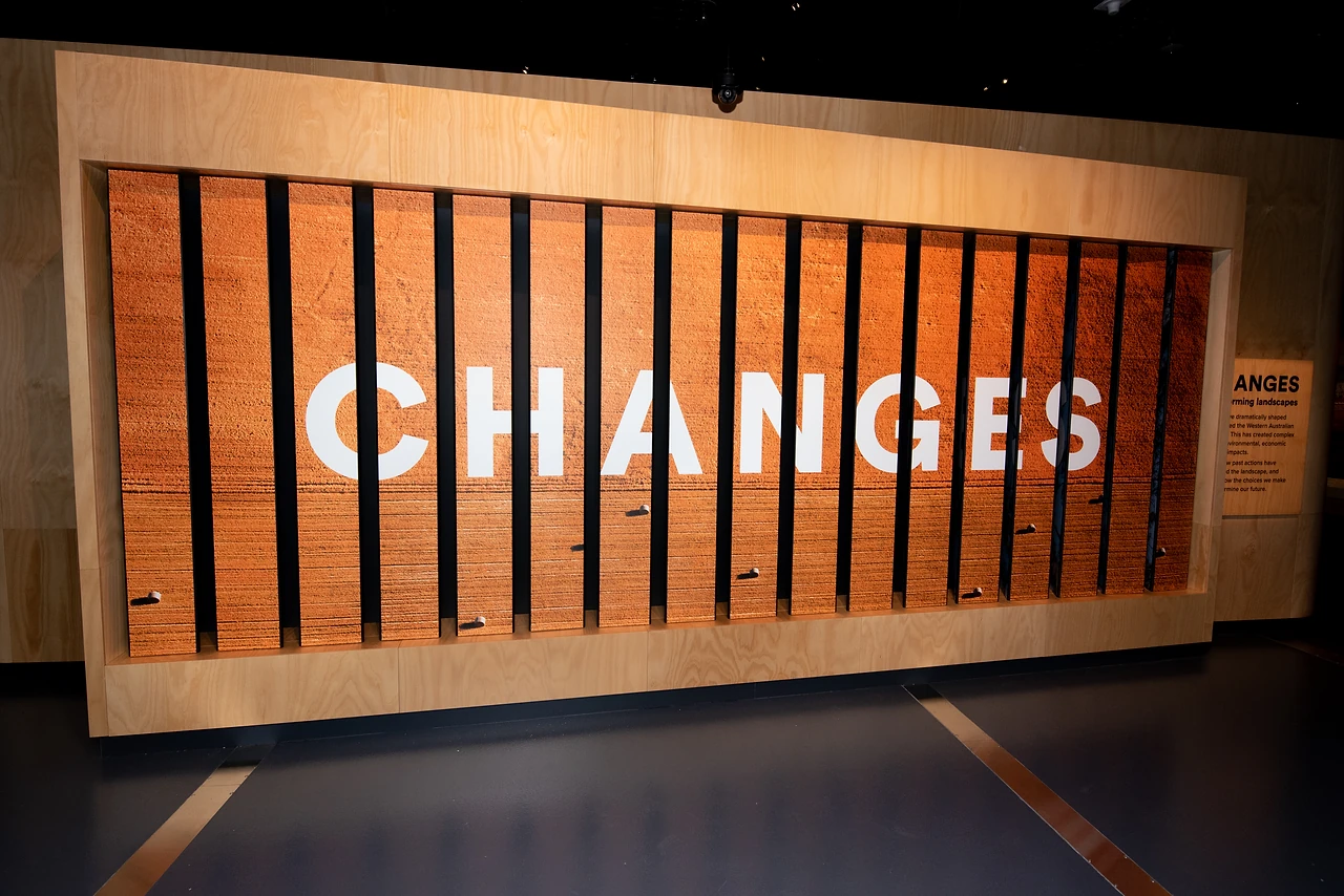 Large timber slat wall with the word CHANGES in cut lettering at the entry to the Changes gallery. Design: Freeman Ryan Design. Photo: Michelle Sammut.
