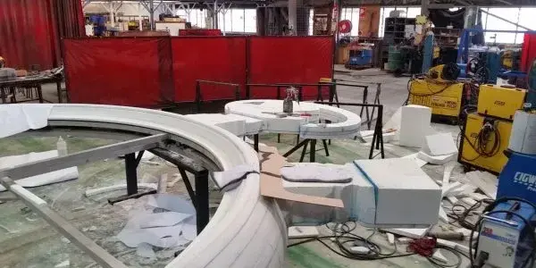 Hand-sculpted theatrical hero prop in the scenic workshop